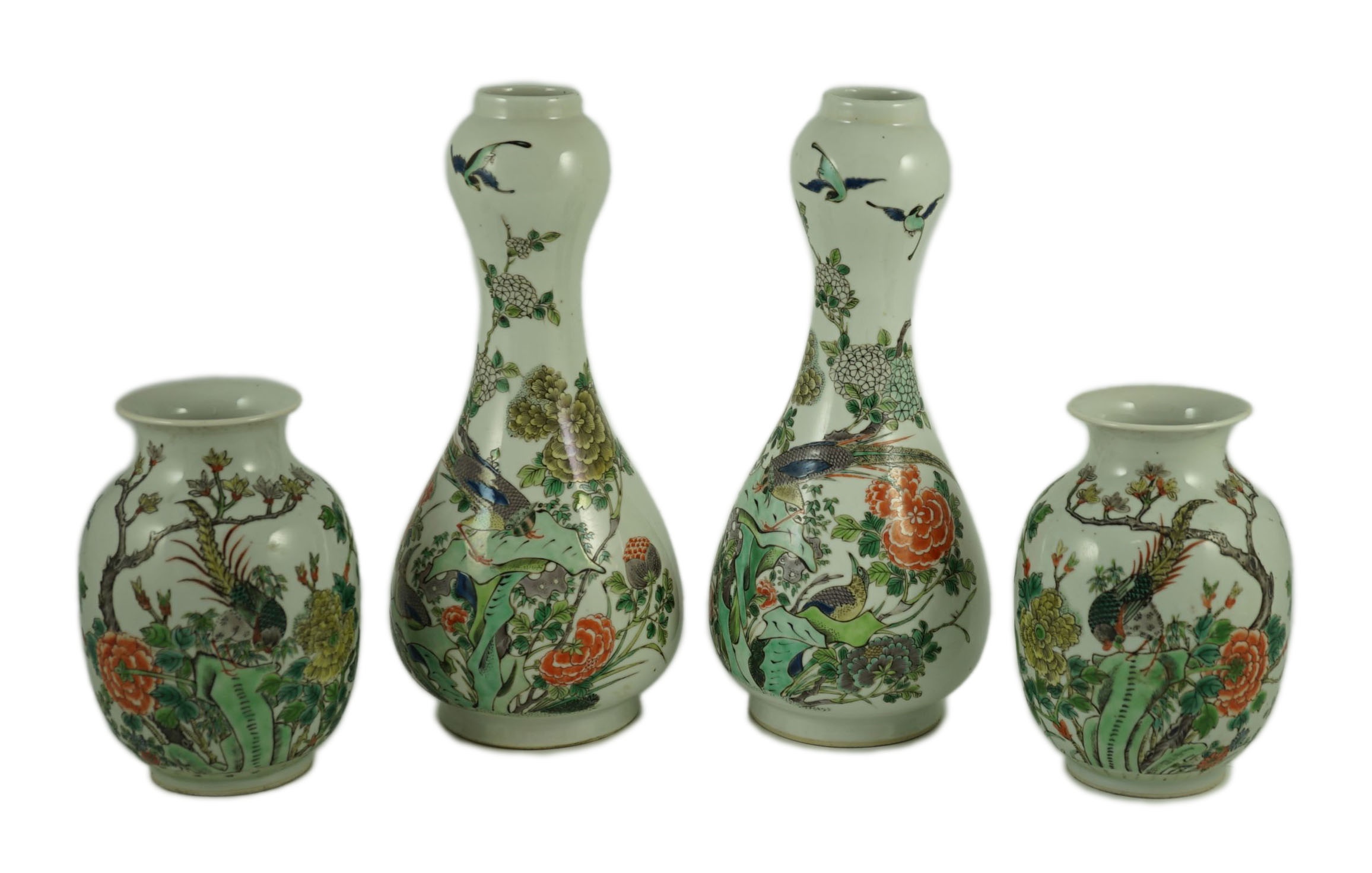 A garniture of four Chinese famille verte vases, 19th century, 31 cm and 17.5 cm high, one small vase cracked to neck